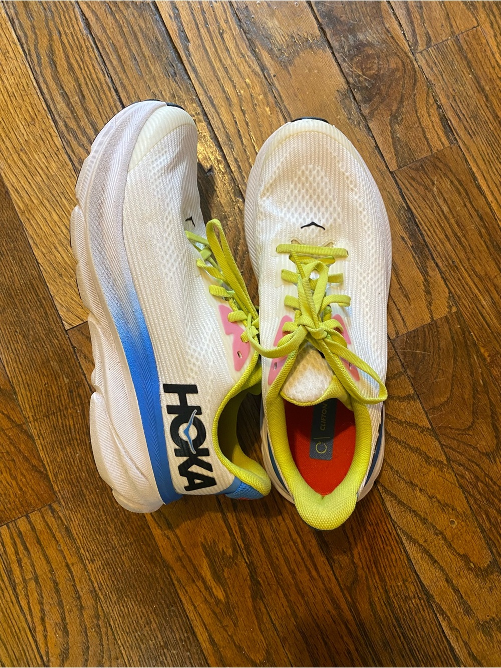 Hoka White Athletic Shoes with Blue Gradient and Neon Yellow Laces